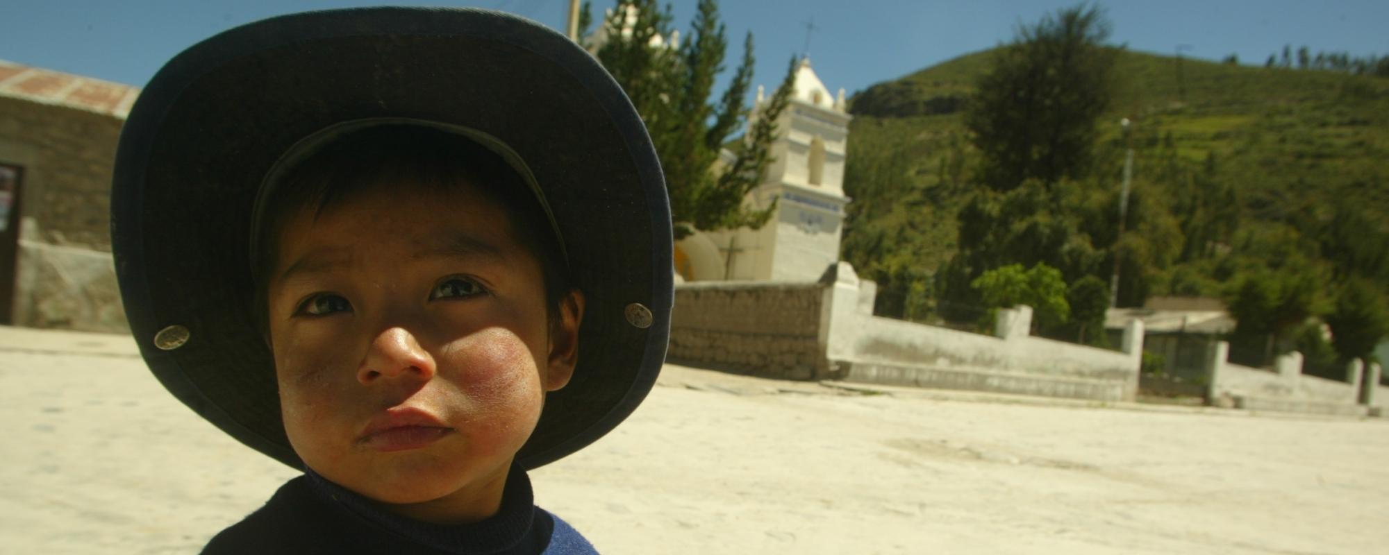 child wearing a wide brimmed hat 